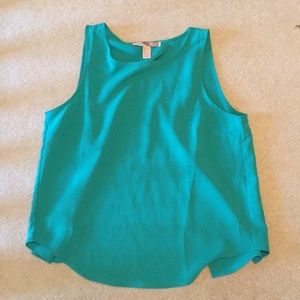 Business in front party in back teal tank